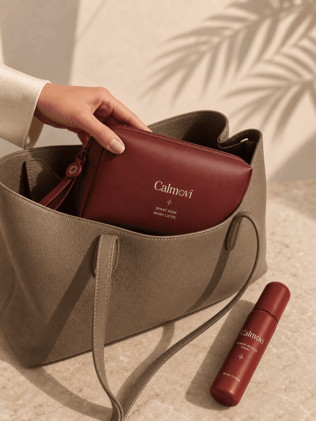 Calmovi waterproof Period Rescue pouch being placed inside a handbag